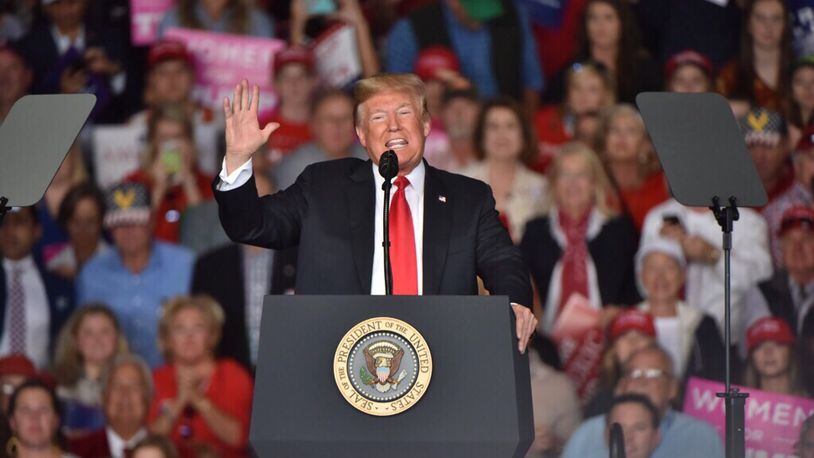 President Donald Trump led thousands of Georgians in a rally Sunday in a cramped airport hangar outside Macon to support Republican candidate for Georgia governor Brian Kemp.