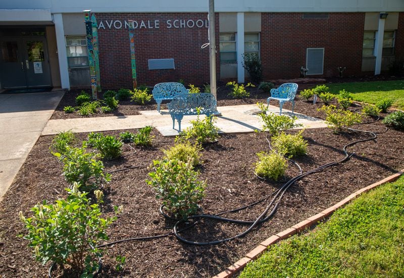 The new garden area in front of Avondale Elementary School features hand-painted totem poles and a lending library. The Avondale Estates Garden Club and the Avon Garden Club worked together on the project.
PHIL SKINNER FOR THE ATLANTA JOURNAL-CONSTITUTION.