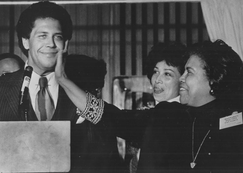 Maynard Jackson (pictured here getting a love pat from him mom) as Valerie Jackson looks on, became Atlanta’s first black mayor when he was elected in 1973. He died in 2003. AJC FILE PHOTO