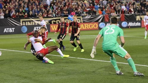 Atlanta United goalkeeper Alec Kann looks on as New York Red Bulls Bradley Wright-Phillips affects the winning goal for a 2-1 victory during the second half in their first game in franchise history on Sunday, March 5, 2017, in Atlanta. Curtis Compton/ccompton@ajc.com