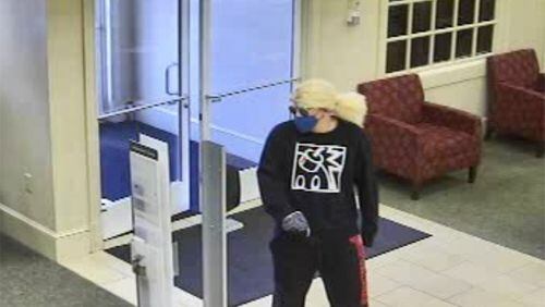 A man wearing a blond wig, dark sunglasses and a bandana over his face robbed a Wells Fargo bank in Macon on Monday, according to authorities.