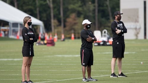 Kirsten Grohs (left), Anthony Robinson and David Bassity at Atlanta Falcons training camp Aug. 22, 2020 in Flowery Branch, Ga. Grohs is the Falcons' manager of football administration. (Photo by Atlanta Falcons/Kara Durrette)