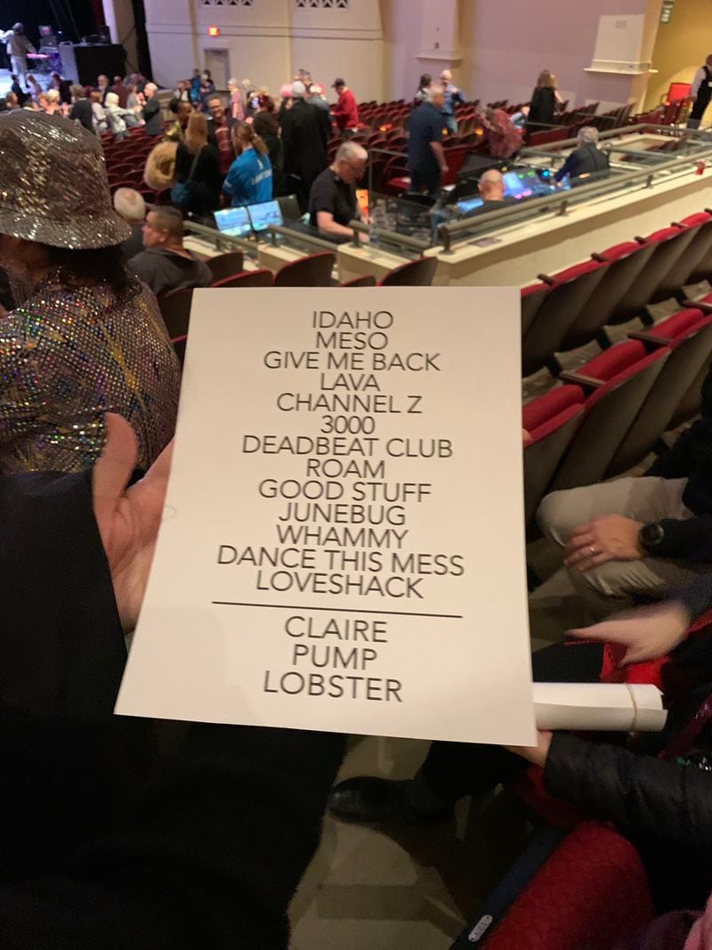 A fan plucked a set list off the stage after the end of the B-52s concert at Classic Center in Athens on January 10, 2023. RODNEY HO/rho@ajc.com