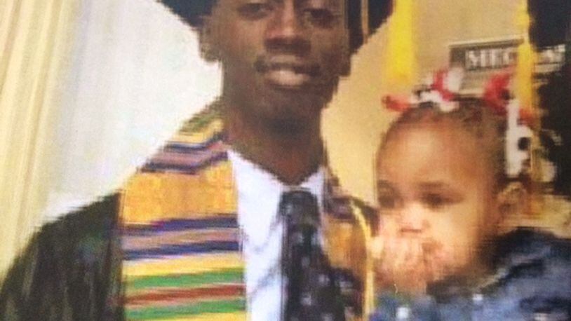 Deaundre Phillips, 24, pictured with his daughter, was shot dead last Thursday outside an Atlanta Police Department annex. (Family photo)