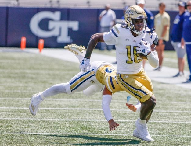 Georgia Tech wide receiver Zion Taylor (18) evades a tackle for a long gain in the closing minutes during the Spring White and Gold game at Bobby Dodd Stadium at Hyundai Field In Atlanta on Saturday, April 13, 2024.   (Bob Andres for the Atlanta Journal Constitution)