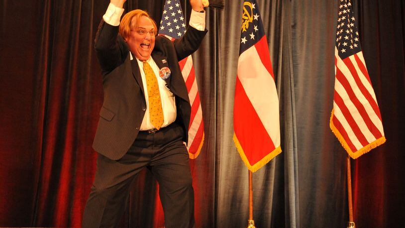 A former Gainesville Times reporter, Harris Blackwood had little in his background suggesting expertise in highway safety before Gov. Nathan Deal put him in charge of that division of his office. Known as an office cutup, he’s seen here claiming a “sweep” for Republicans at a 2010 election night event. BRANT SANDERLIN / AJC