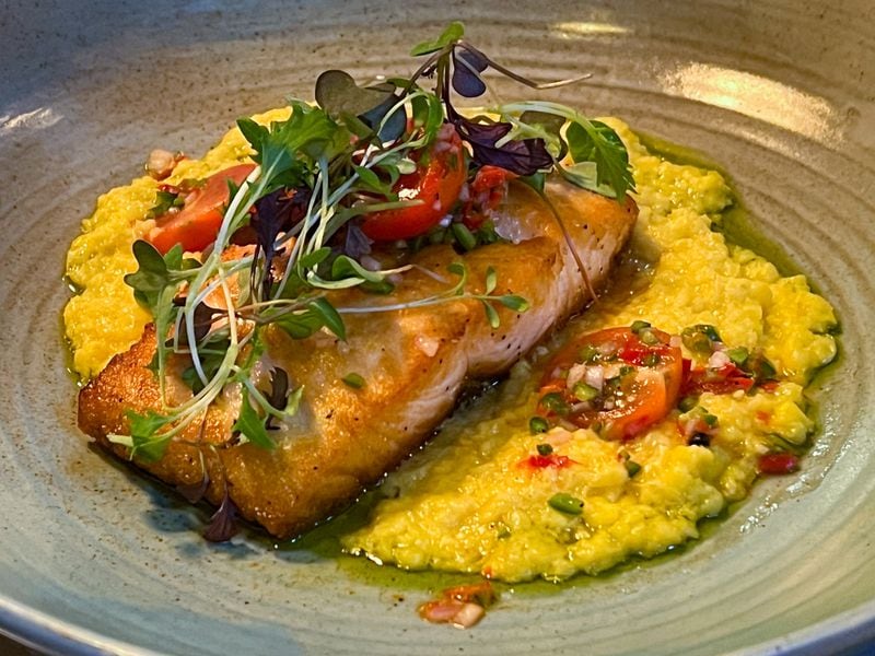 Seared salmon at Sebastian was well-executed, but not worth the $45 cost. Henri Hollis/henri.hollis@ajc.com