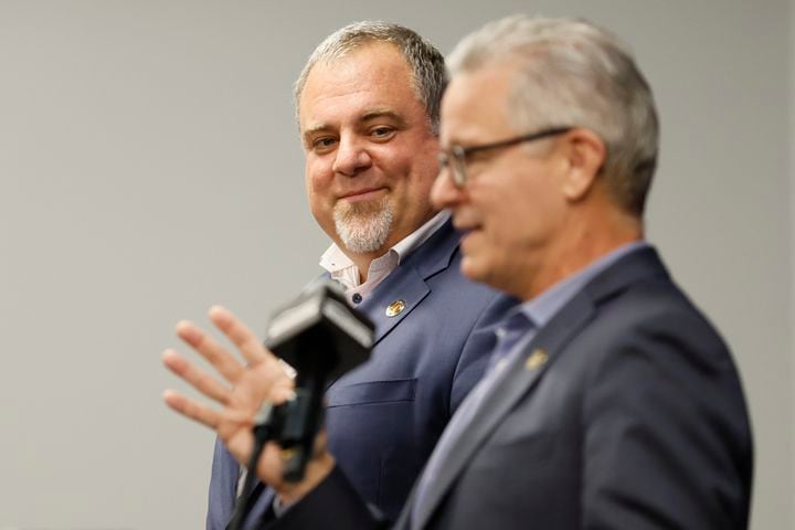 Atlanta United CEO/President Garth Lagerwey smiles as he listens to AMB Sports and Entertainment CEO Steve Cannon answer questions Tuesday in Atlanta. (Miguel Martinez / miguel.martinezjimenez@ajc.com)
