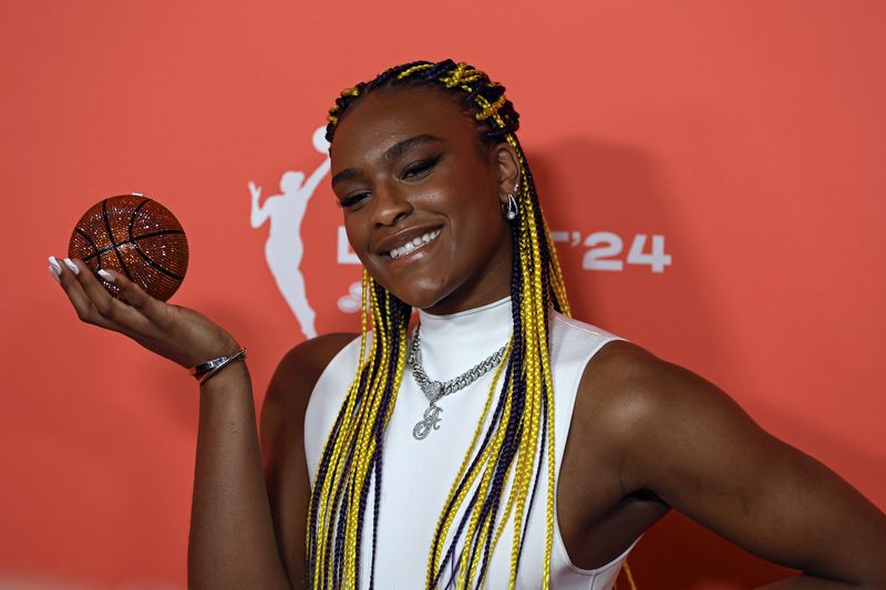 UConn's Aaliyah Edwards poses for a photo before the WNBA basketball draft on Monday, April 15, 2024, in New York. (AP Photo/Adam Hunger)