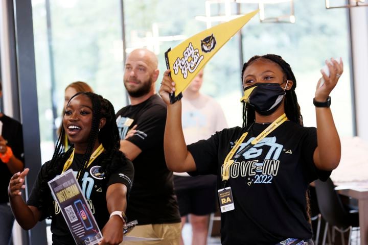 Masadericka Ampafo (left) and Joi Palmore cheer on the arrival of the new residents at The Summit, the new building located on campus at Kennesaw State University that will house 500 first-year students. (Miguel Martinez / miguel.martinezjimenez@ajc.com)
