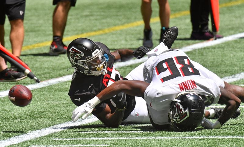 Falcons wide receiver Antonio Nunn (86) collides with safety Richie Grant (27) during the open practice Saturday, Aug. 7, 2021, at Mercedes-Benz Stadium in Atlanta. (Hyosub Shin / Hyosub.Shin@ajc.com)