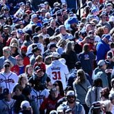 Baseball fans wait for gates to open before a game at Truist Park, Friday, April 5, 2024, in Atlanta. (Hyosub Shin / Hyosub.Shin@ajc.com)