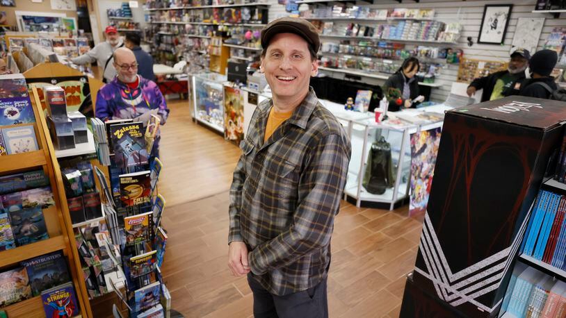 Galactic Quest owner Kyle Puttkammer poses for a photograph at his store in Lawrenceville; he opened the shop over 30 years and said most customers buying toys now are adults. In addition, the items they purchase are often designed more for display than for play, he said. Miguel Martinez / miguel.martinezjimenez@ajc.com