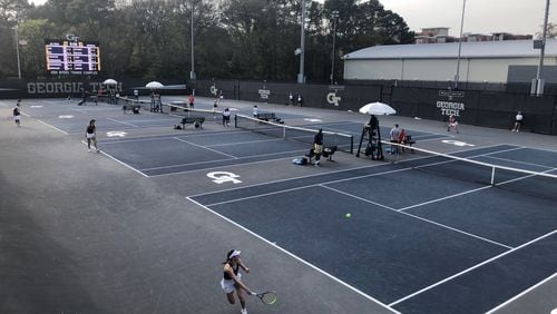 Georgia Tech and Georgia's women's tennis teams square off at Tech's Ken Byers Tennis Complex on Wednesday. Tech's Kylie Bilchev is in the foreground. (AJC photo by Ken Sugiura)