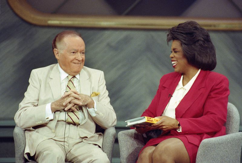Comedian Bob Hope laughs with television talk show host Oprah Winfrey during a taping in Chicago. Hope reminisced before an audience that included war veterans that he entertained overseas. 