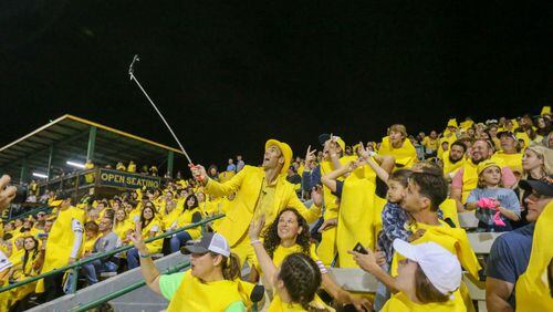 Savannah Bananas owner Jesse Cole takes selfies with fans during Banana Fest on Saturday February 25, 2023 at Historic Grayson Stadium.