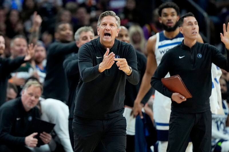 Minnesota Timberwolves head coach hChris Finch calls times out during the second half of Game 3 of an NBA basketball first-round playoff series against the Phoenix Suns, Friday, April 26, 2024, in Phoenix. (AP Photo/Matt York)