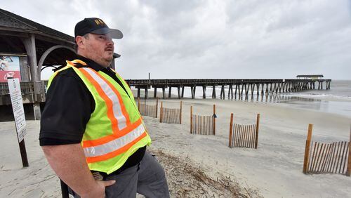 Andy Martz, with GDOT H.E.R.O. Unit, surveys near Tybee Island Pier on Thursday, September 5, 2019. Hurricane Dorian has toppled trees and knocked out power to more than 15,000 customers in this region, including more than half of those on Tybee Island.