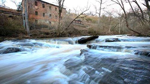 The Roswell City Council has approved spending $452,270 to improve trail access to the mill ruins and other parts of Old Mill Park. AJC FILE