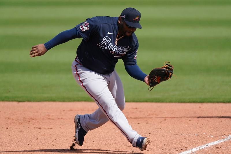 Atlanta Braves first baseman Pablo Sandoval fields a ground ball during a spring training game Wednesday, March 10, 2021, against the Boston Red Sox in Fort Myers, Fla.. (John Bazemore/AP)