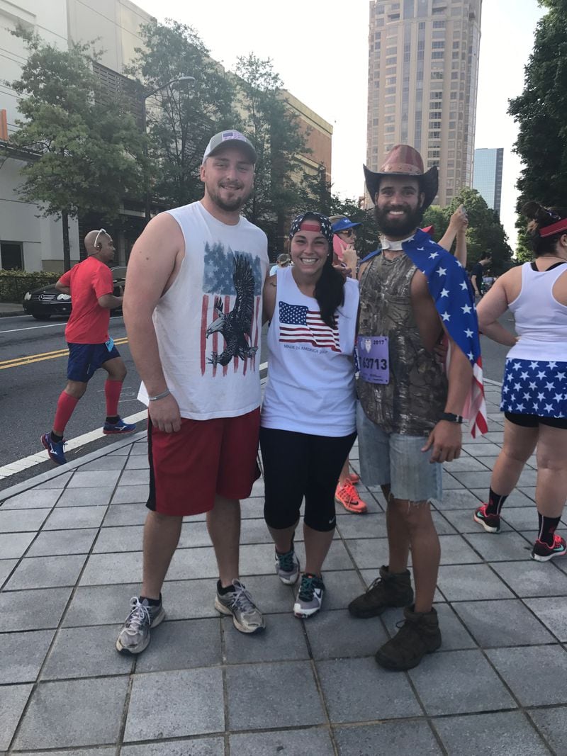 "I hiked the Appalachian trail in these boots, I'm not worried. These are my lucky boots," said Zach Lambert, who is running the Peachtree for the first time. He's running with friend HeatherBlumenfeld (second year running) and Ben Johnston (fourth year). All three are from Douglasville.