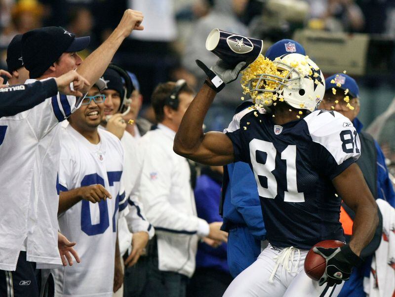 Terrell Owens throws popcorn in his face after scoring a touchdown against the Packers.
