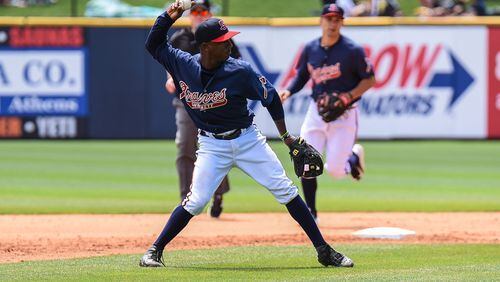 Ozzie Albies loads up to throw out a base runner for the Gwinnett Braves. (Sean Hackney / Special to the AJC)