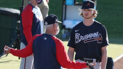 Braves starter pitcher Mike Soroka back in spring, when his return seemed near. He's working with pitching coach Rick Kranitz in this photo.   Curtis Compton / Curtis.Compton@ajc.com”