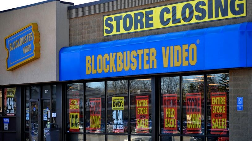 FILE - This March 17, 2010, file photo, shows a closing Blockbuster stores in Racine, Wis. Dish Network announced Wednesday, Nov. 6, 2013, it will close the remaining 300 Blockbuster locations scattered across the United States. Dish Network expects the stores to be closed by early January. Dish Network says about 2,800 people will lose their jobs. (AP Photo/Journal Times, Scott Anderson, File)