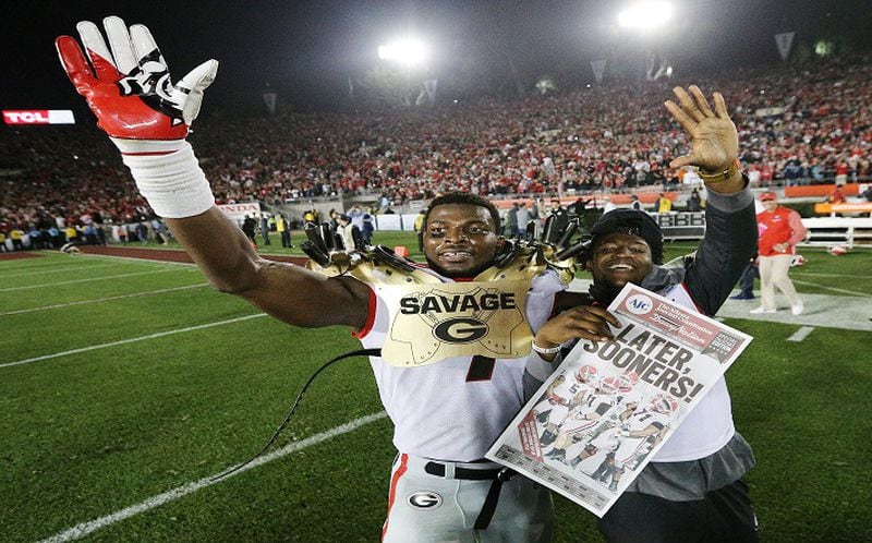 Georgia linebacker Lorenzo Carter and Rashad Roundtree celebrate beating Oklahoma 54-48 during double overtime in the College Football Playoff Semifinal at the Rose Bowl Game on Monday, Jan. 1, 2018, in Pasadena, Calif. (Curtis Compton/Atlanta Journal-Constitution)