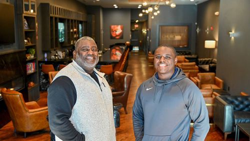 Bruce Riggins, left, owner of Churchills on Cherry, and his son Nicholas Riggins (Photo Courtesy of Jason Vorhees/The Telegraph)