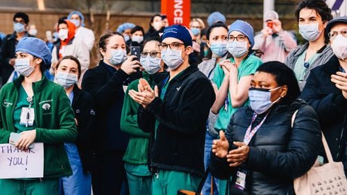 Medical workers in April. Despite the intense need for treatment of COVID-19 patients, many other procedures are not being done and millions of healthcare workers have been laid off or furloughed. (Bloomberg photo by Nina Westervelt)