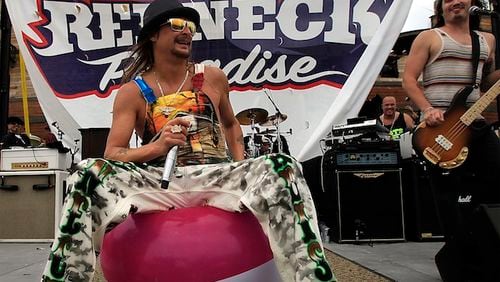 Kid Rock playfully sits on a large beachball that floated onstage during his performance at Half Moon Cay, which was rechristened "Redneck Paradise" by the Detroit based star and his tour organizers. (Luis Sinco/Los Angeles Times/TNS)