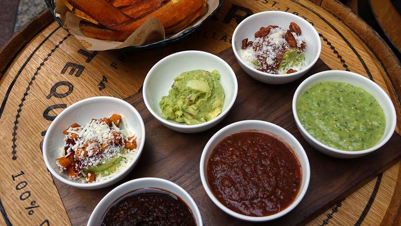 The guacamole and salsa tasting at Alma Cocina features three types each of guacamole and salsa with a basket of plantain chips and tortilla chips. / Photo by Fifth Group Restaurants