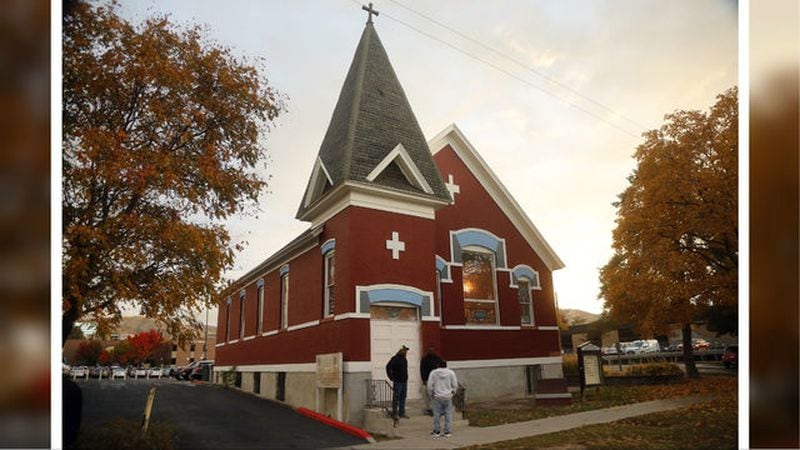 People gather outside Trinity AME Church in Salt Lake City on Oct. 23, 2018. The church was the site where Melvin Shawn Rowland, who was suspected of killing his ex-girlfriend, 21-year-old Lauren McCluskey, took his life that morning.