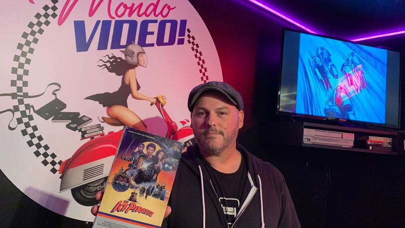 Woodstock animator Anthony Sant'Anselmo spent three years building out his dream 1980s era video rental store in his basement called Mondo Video. He spared no details. RODNEY HO/rho@ajc.com