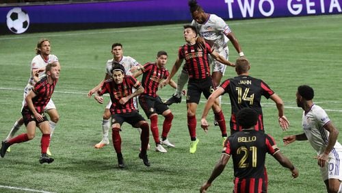 110120 Atlanta: Atlanta United defenders try to block a header by Cincinnati's Kendall Watson that goalkeeper Brad Guzan was able to save during their 2-0 victory Sunday, Nov. 1, 2020, at Mercedes-Benz Stadium in Atlanta. (Curtis Compton / Curtis.Compton@ajc.com)