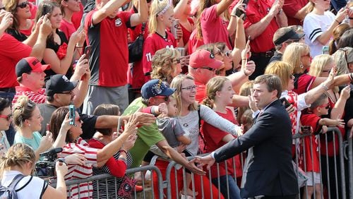 Georgia fans greet coach  Kirby Smart during the team’s “Dawg Walk” into Sanford Stadium before Saturday’s game against South Carolina.