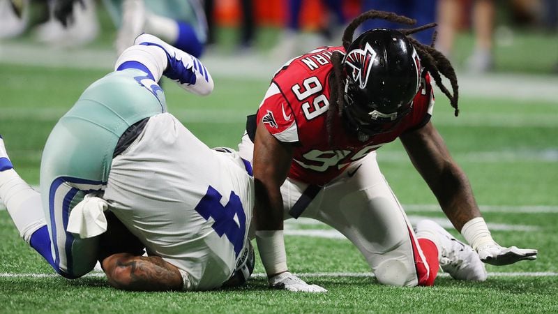Falcons defensive end Adrian Clayborn records the fifth sack of Cowboys quarterback Dak Prescott during the second half in a NFL football game on Sunday, Nov. 12, 2017, in Atlanta.