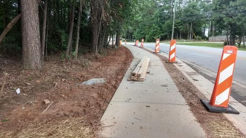 Contractors continue work to construct sidewalks on Whitehead and Suwanee Dam Roads in Sugar Hill.
