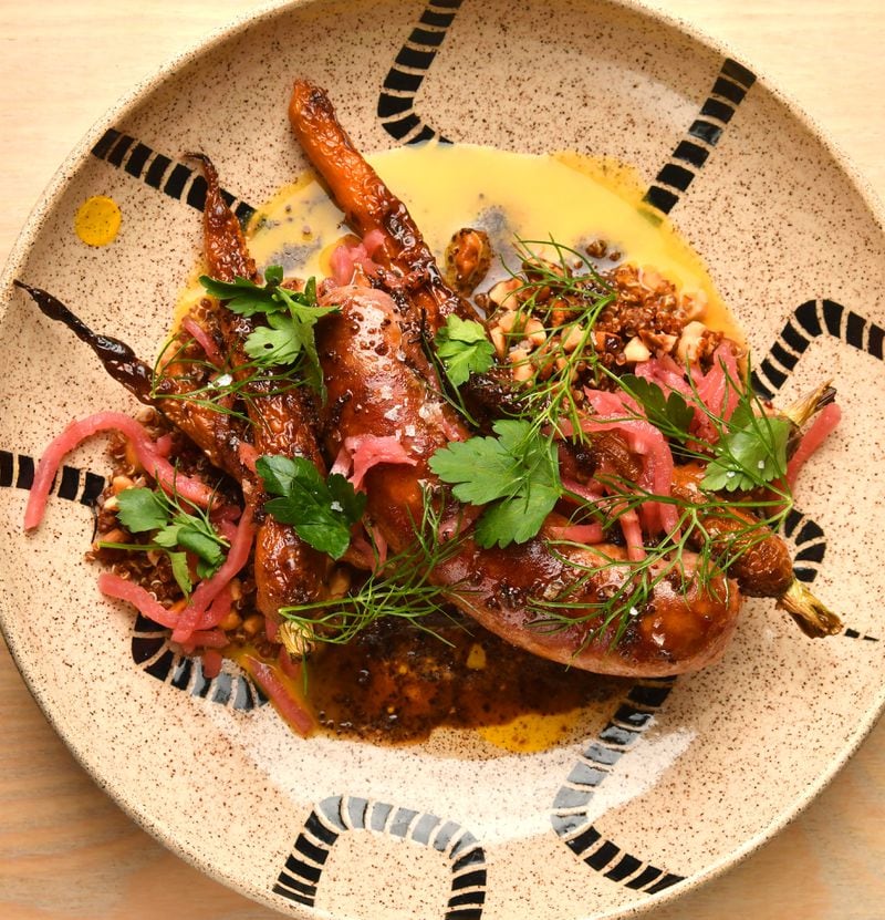 Sausage over Hazelnut Quinoa with Roasted Carrots and Coffee Vinaigrette was developed by Jarrett Stieber, now of Summerhill restaurant Little Bear. (Styling by Jarrett Stieber / Chris Hunt for the AJC)