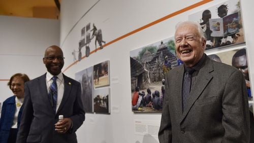 Former President Jimmy Carter, right, Dr. Donald Hopkins, center, and Rosalynn Carter, far left, have led a worldwide effort from the Carter Center to eradicate Guinea worm disease. (DAVID BARNES / DAVID.BARNES@AJC.COM)