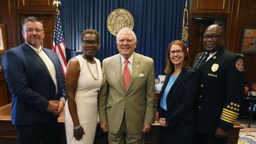 Gov. Nathan Deal (center) held a press conference on June 6 where he awarded a grant of $1.5 million to the city of Fairburn for a roadway project. CONTRIBUTED
