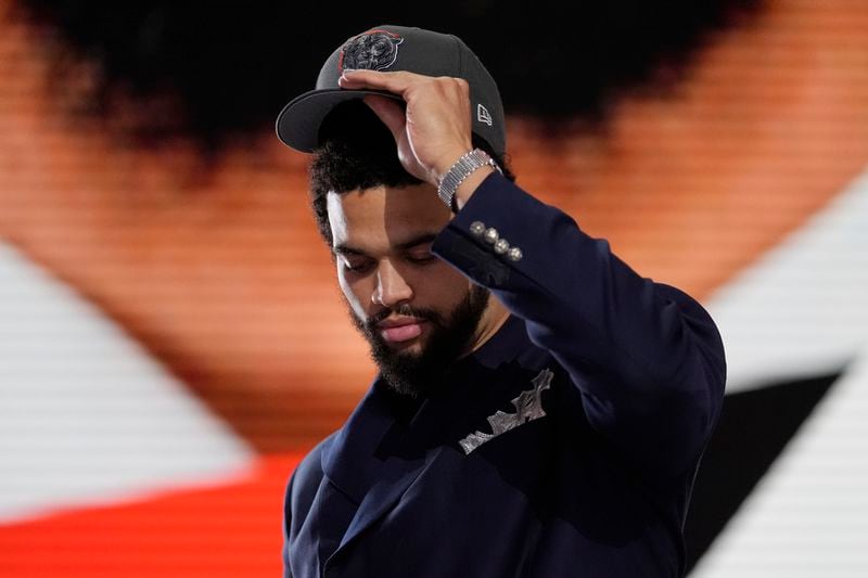 Southern California quarterback Caleb Williams celebrates after being chosen by the Chicago Bears with the first overall pick during the first round of the NFL football draft, Thursday, April 25, 2024, in Detroit. (AP Photo/Jeff Roberson)