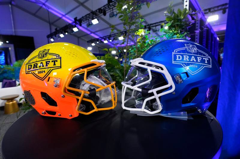 Helmets are displayed in the NFL Draft green room, Wednesday, April 24, 2024, in Detroit. (AP Photo/Paul Sancya)