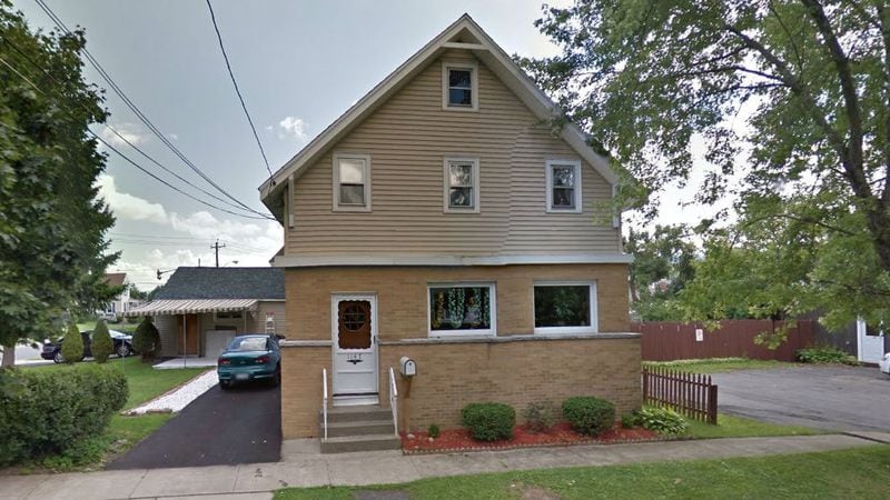 An August 2011 Street View image shows the Utica, New York, home where Naythen Aubain, 29, is accused of killing and dismembering his 90-year-old grandmother, Katerine Aubain, and their landlord, Jane Wentka, 87. Parts of Wentka's body were found inside her apartment, while others were found on the street. Katerine Aubain's remains were found buried in a shallow grave about 10 miles from the crime scene.
