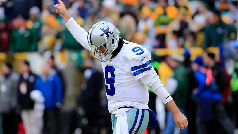 GREEN BAY, WI - JANUARY 11: Quarterback Tony Romo #9 of the Dallas Cowboys reacts after the Cowboys scored against the Green Bay Packers in the second qaurter of the 2015 NFC Divisional Playoff game at Lambeau Field on January 11, 2015 in Green Bay, Wisconsin. (Photo by Rob Carr/Getty Images)