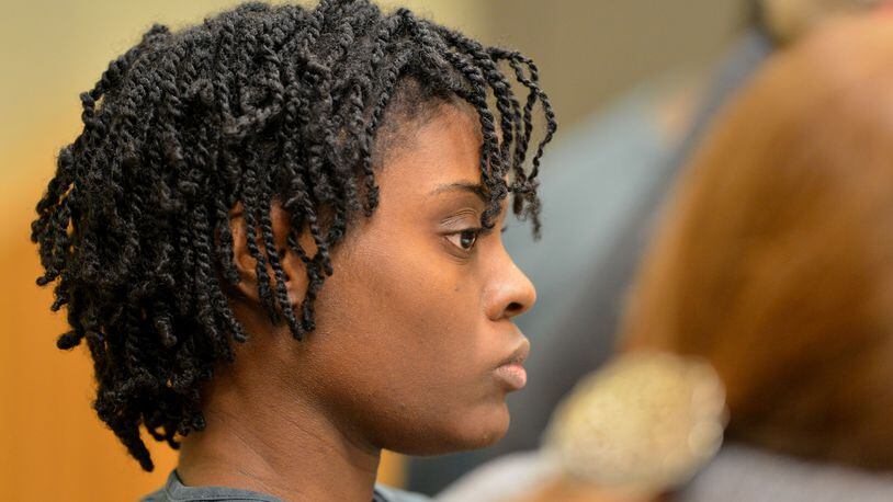 Tiffany Moss, of Lawrenceville, faces the death-penalty on charges she starved to death her 10-year-old stepdaughter, Emani, and then set her body on fire to cover up the crime. KENT D. JOHNSON / KDJOHNSON@AJC.COM
