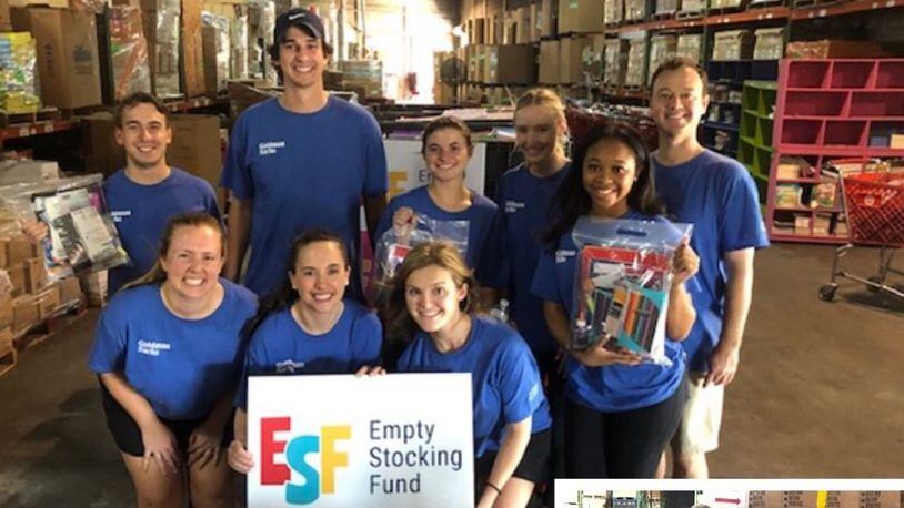 The Empty Stocking Fund plans to distribute school supplies to 30,000 Atlanta-area students this year. Shown here volunteers from the Goldman Sachs Atlanta office recently helped assemble Student Supply Kits. (Courtesy Empty Stocking Fund)