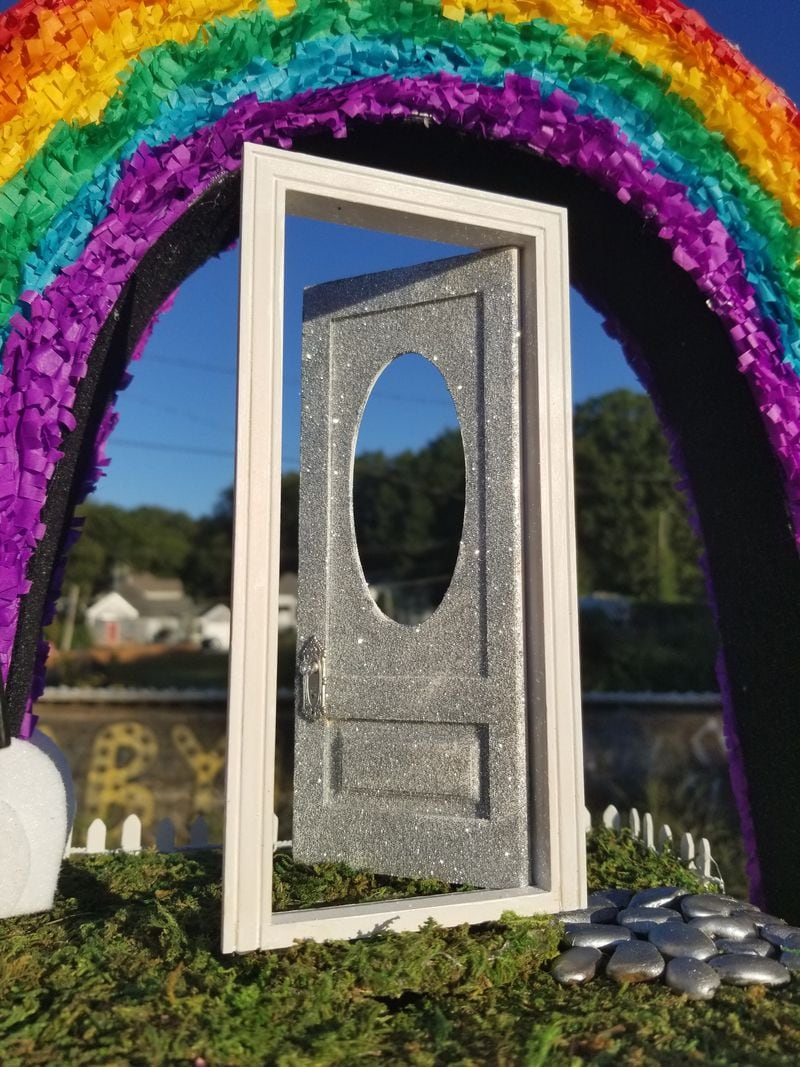 The sparkling silver door atop the float is open, to represent openness and acceptance.